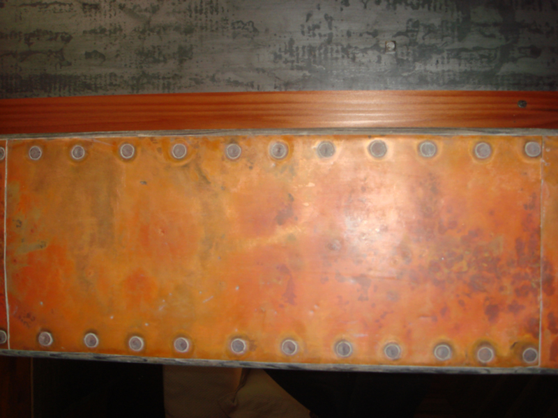 Pounded and Flamed Copper Mantle with Steel Rivets